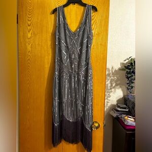 Sexy evening dress. Beautiful Gray and sequins with black fringe.